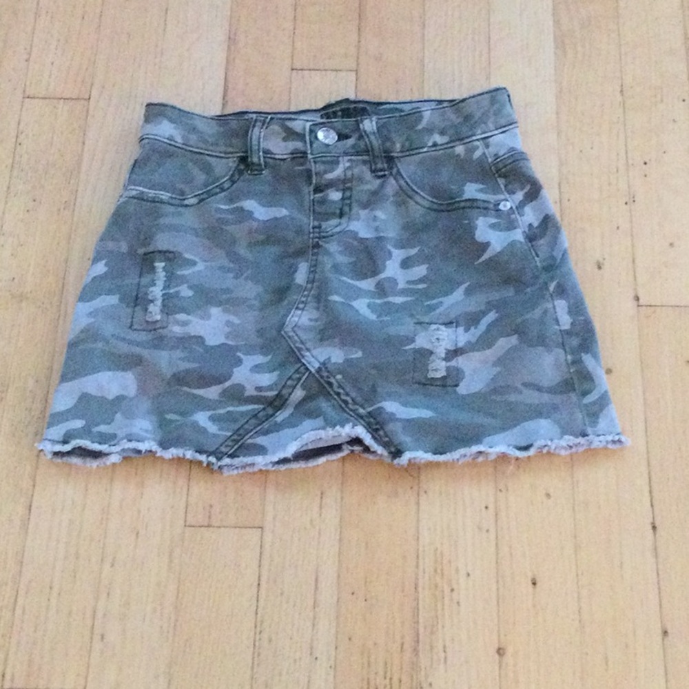 Justice camouflage skirt with built-in shorts.